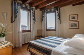 Гостиница Palazzo Brando - Living Apartments  Тревизо